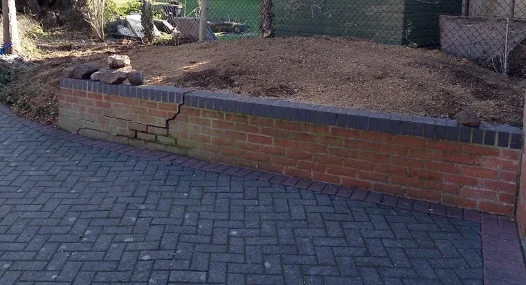 The same bed after grinding, with the ground visible in front of the shed